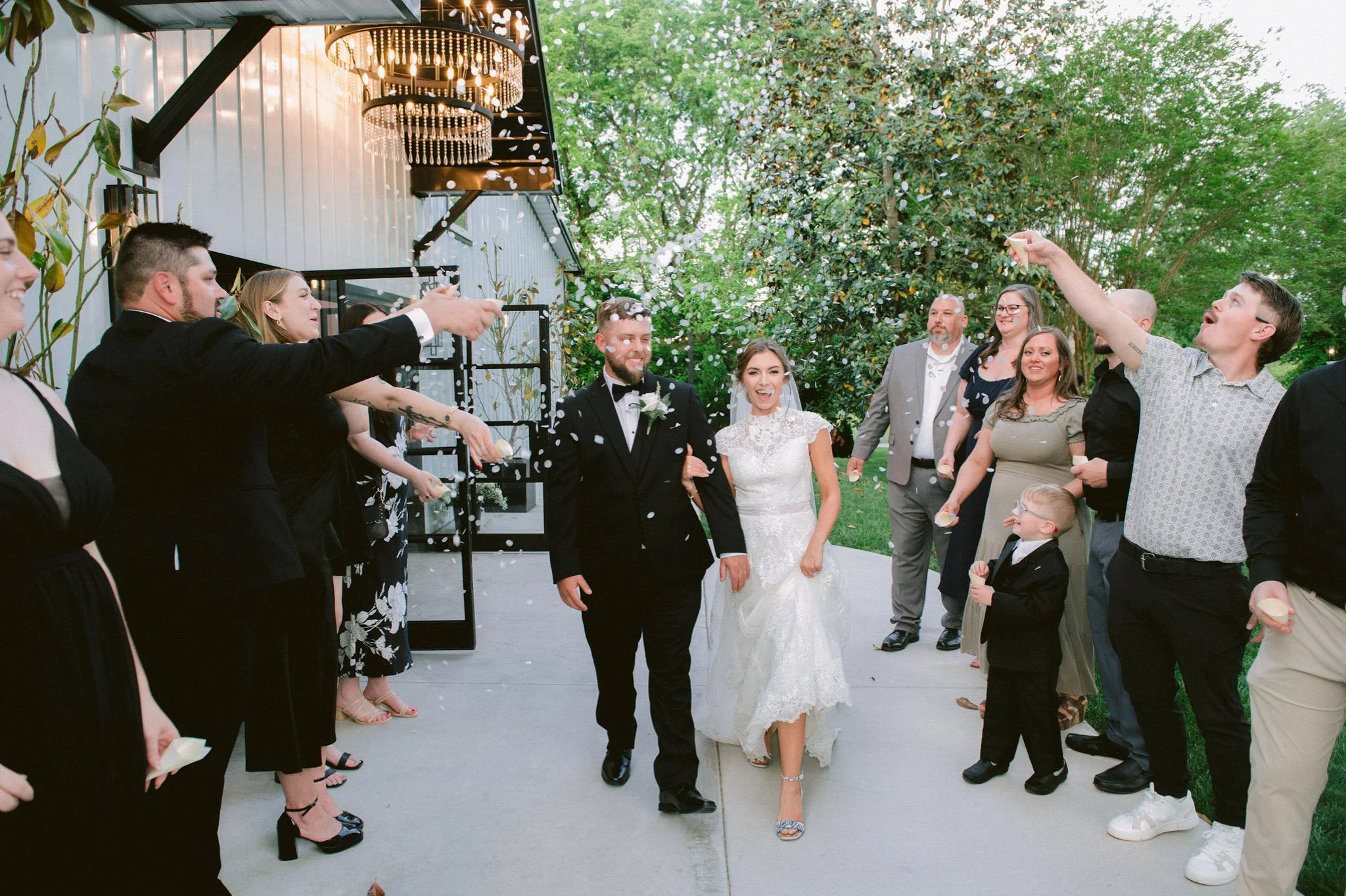 bride and groom exit at Macca Villa