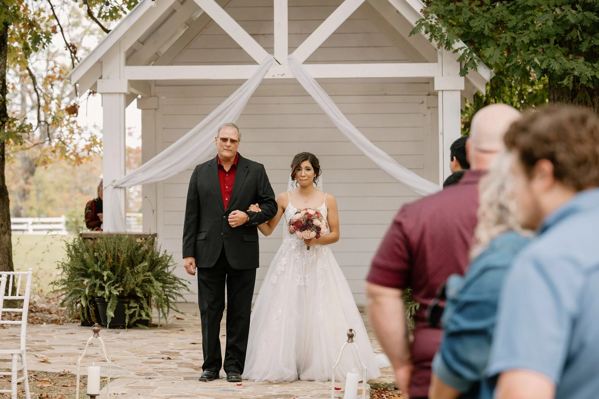 bride walking down the aisle at The Glass House