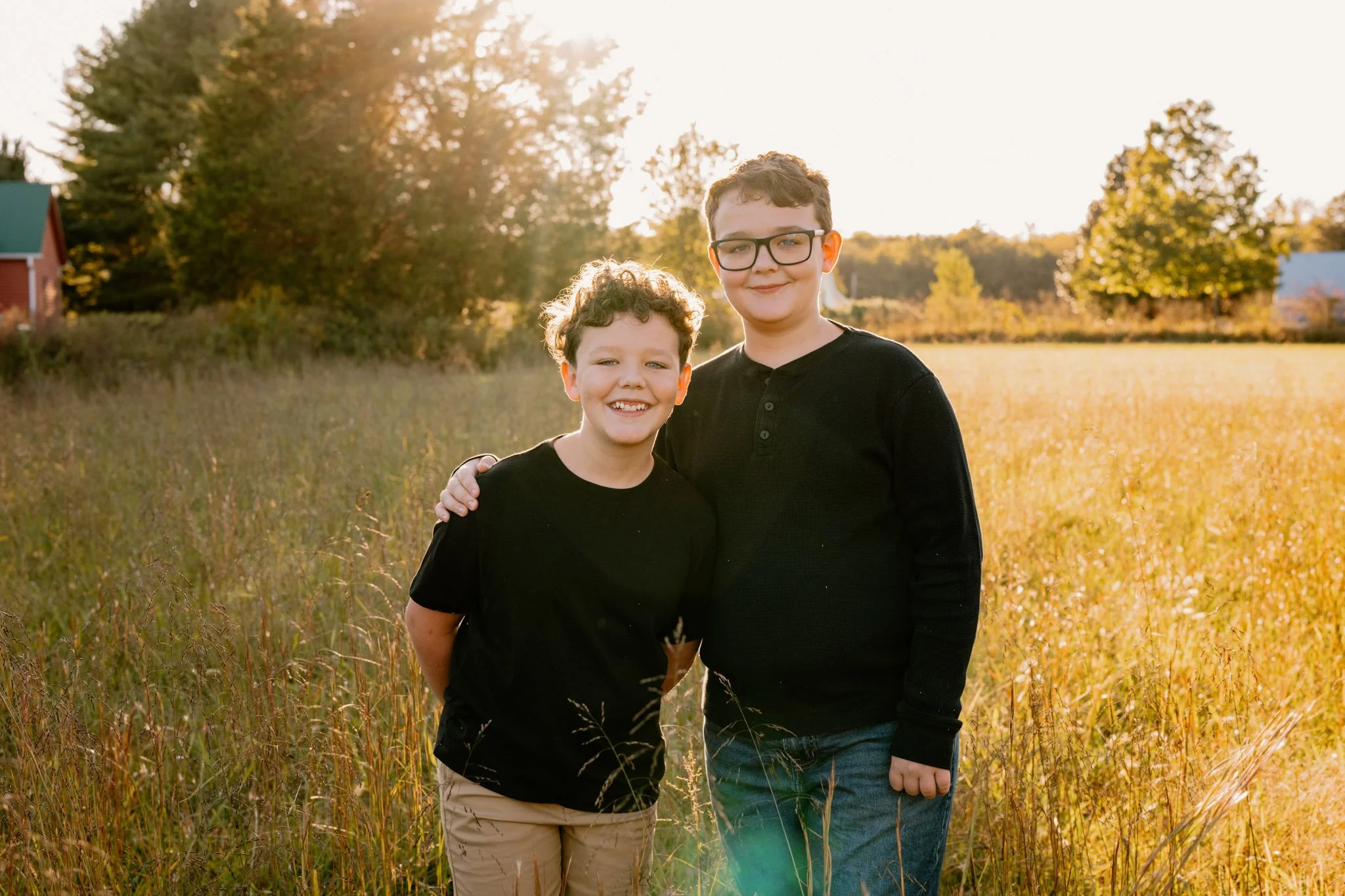Two boys smiling during their fall family photo session
