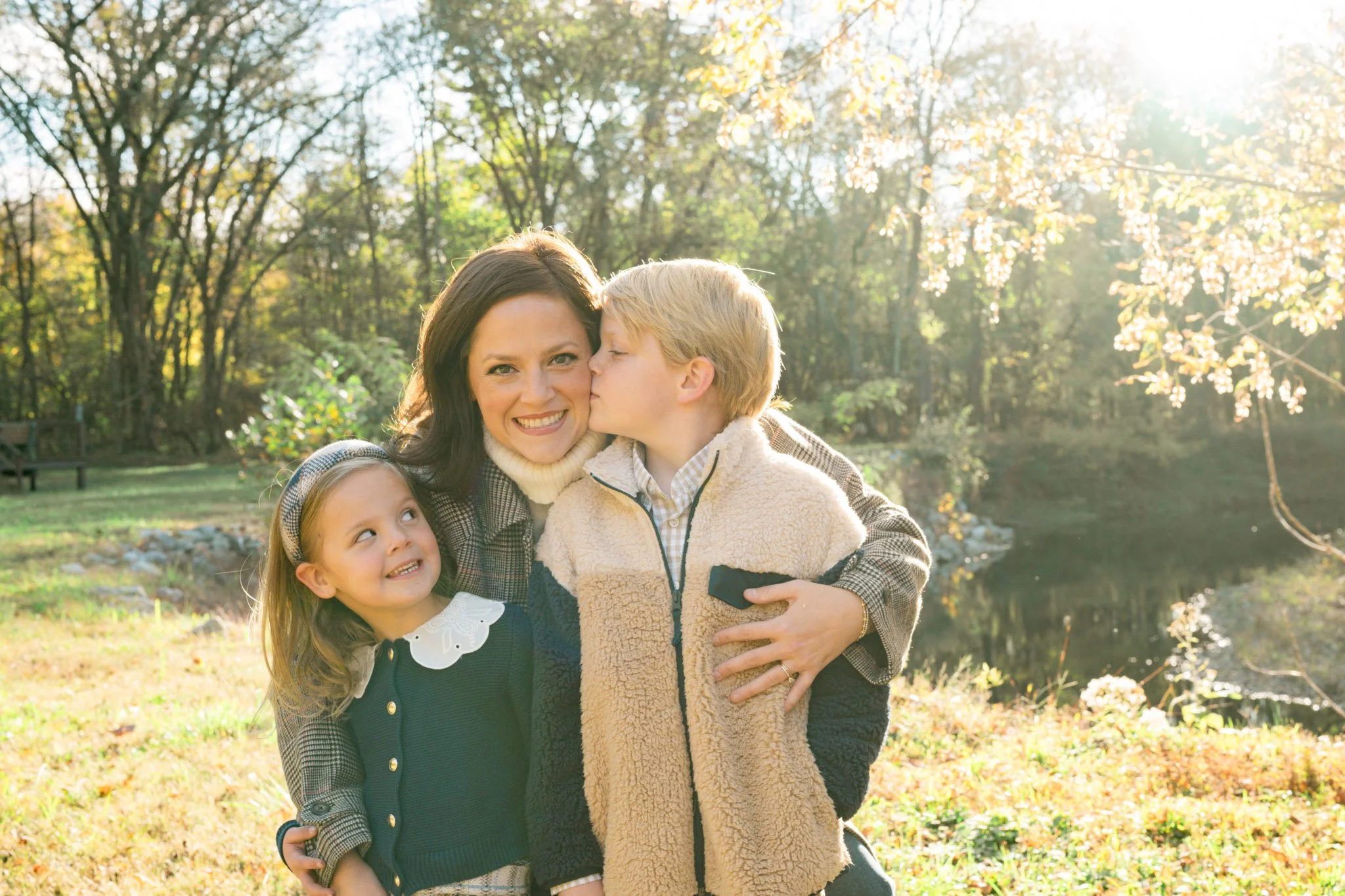 two kids hugging their mom during nashville family photo shoot