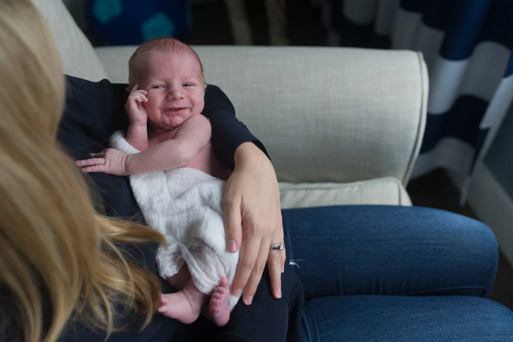 newborn_smiles_in_mothers_arms.jpg