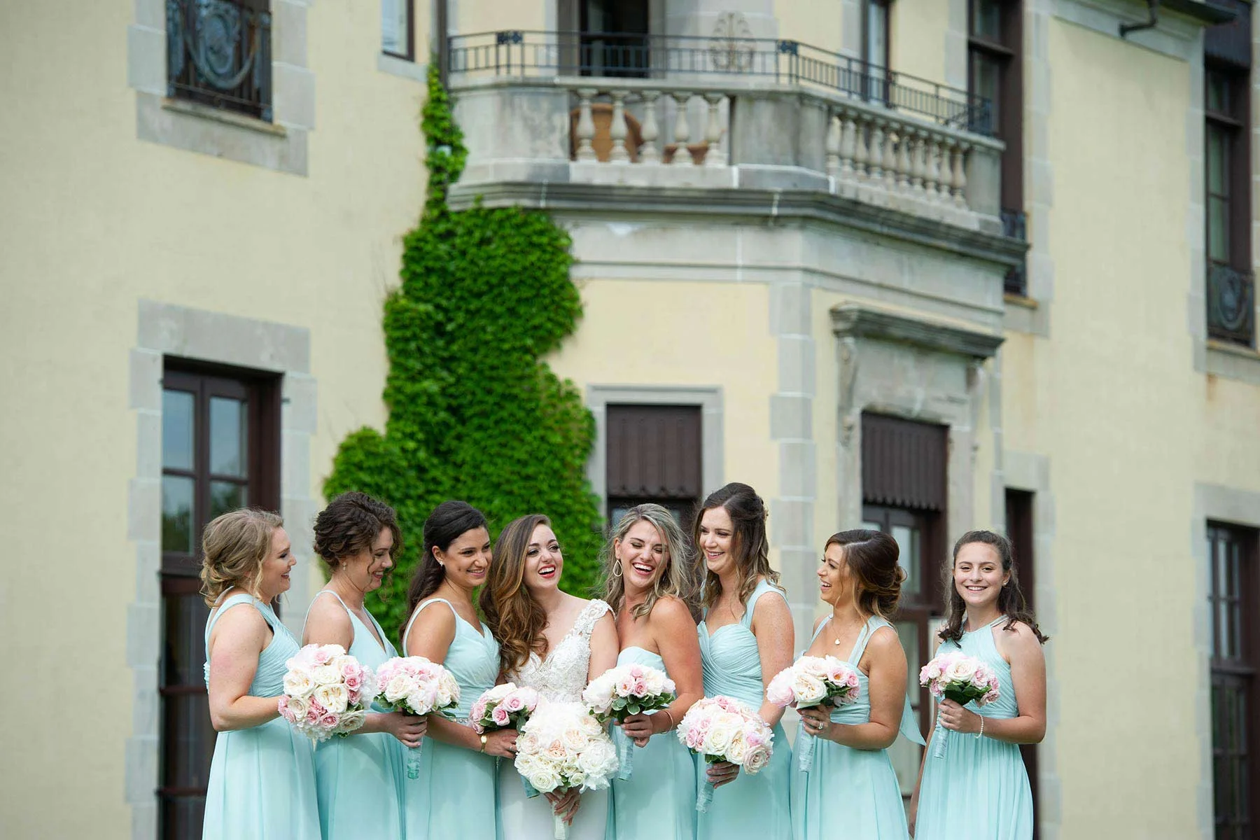 15_Bridesmaids_pose_outsie_Oheka_Castle.jpg
