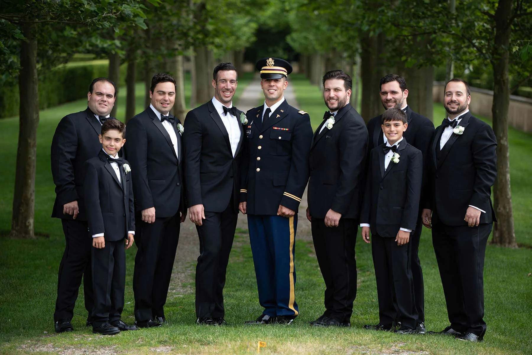 16_Groomsmen_pose_outside_Oheka_Castle.jpg
