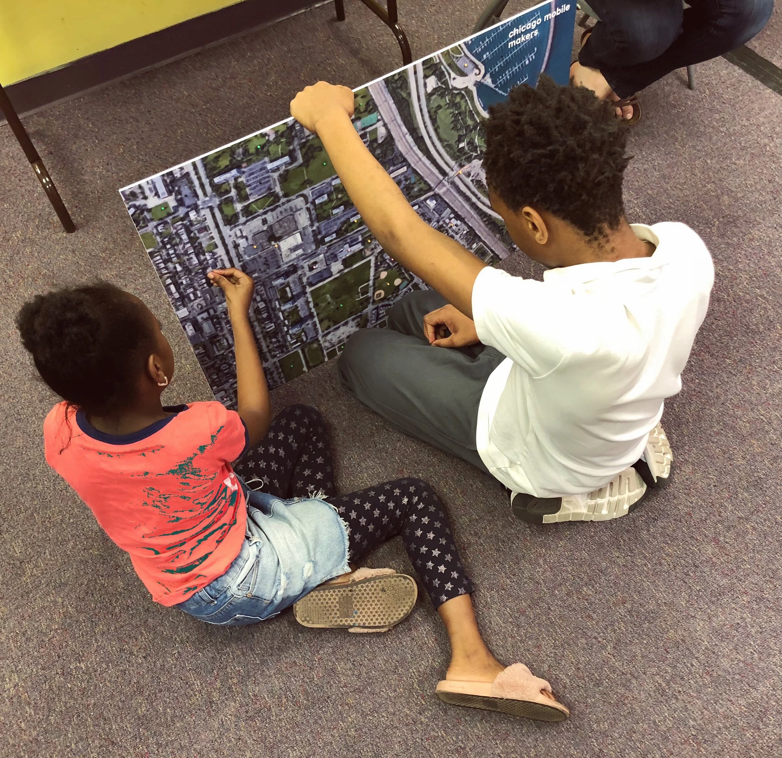 Students get a closer look at the map of their neighborhood.
