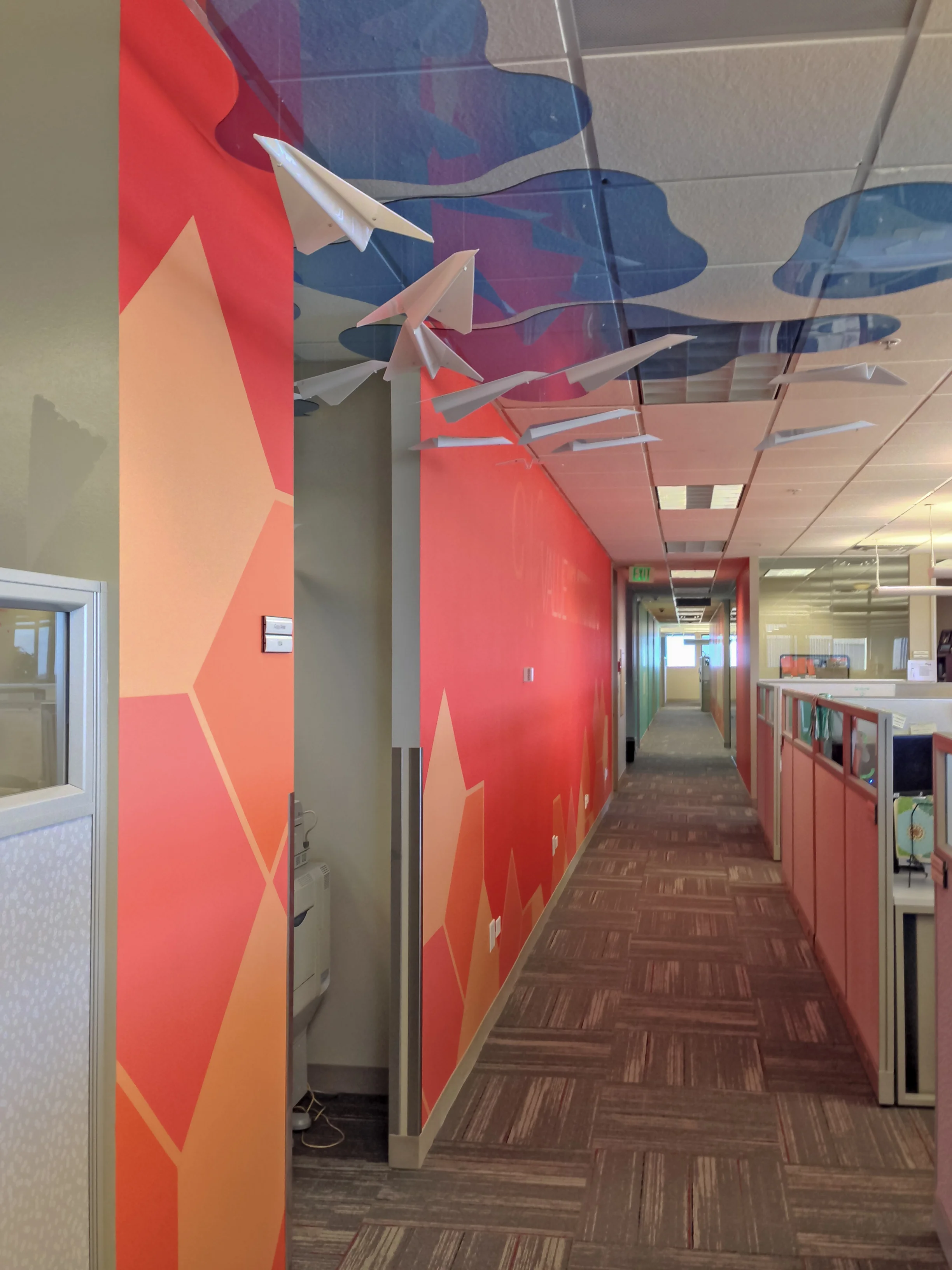 Dimensional acrylic airplanes above copier
