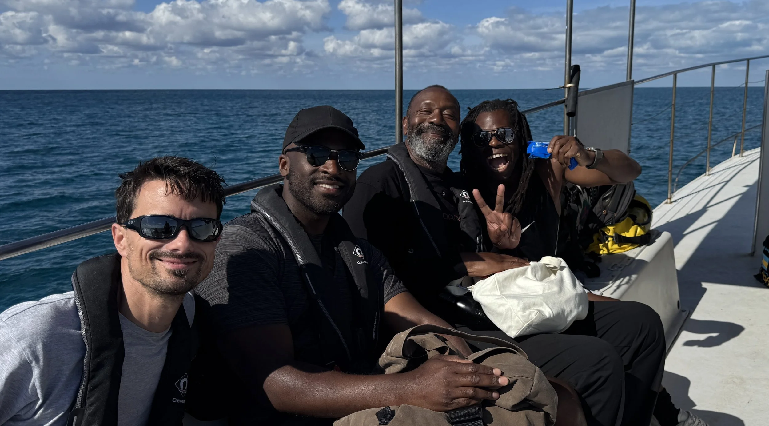 With fellow director Adrian Hylton, and Sir Lenny Henry and Ade Adepitan filming Shark! Celebrity Infested Waters for ITV, 2025.