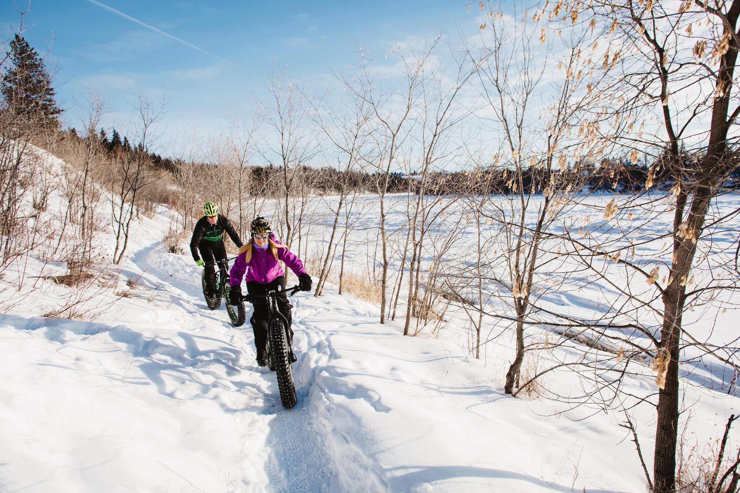 River Valley_A couple rides their bikes on a snowy trail in the winter.jpg