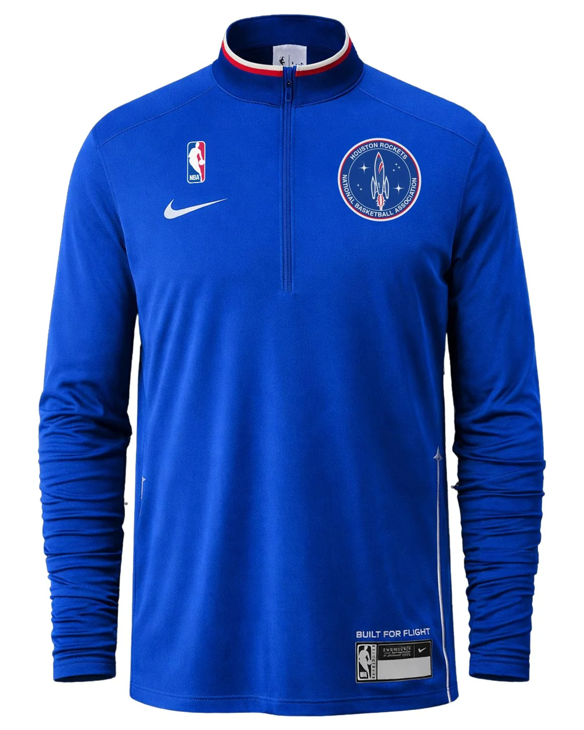 Royal-blue Nike quarter-zip warmup with a red, white and navy collar, the mission-patch crest on the chest and a “Built for Flight” jock tag.