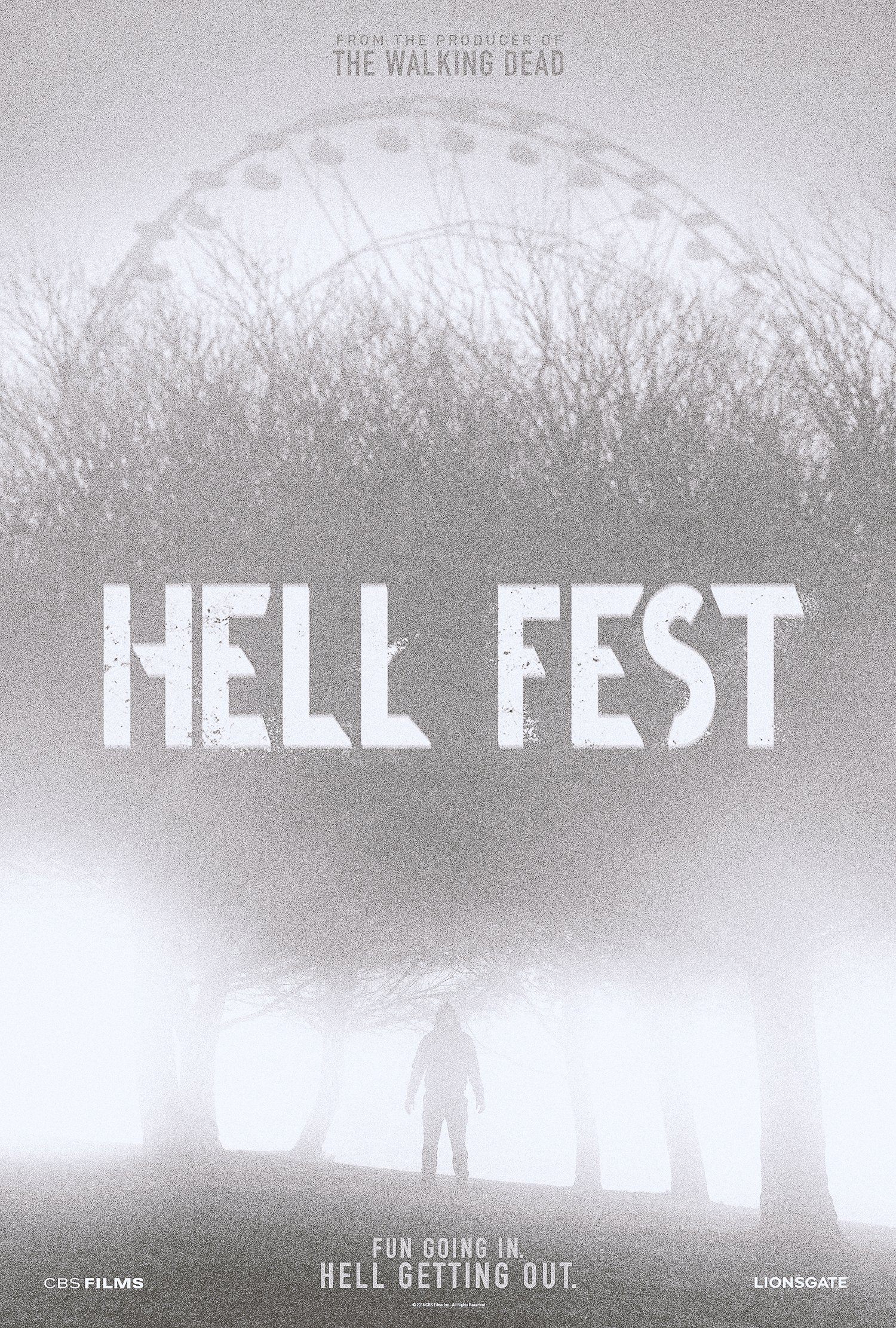 Hell Fest one-sheet, direction B: a pale Ferris wheel over bare trees in heavy fog, with one figure standing below the title.