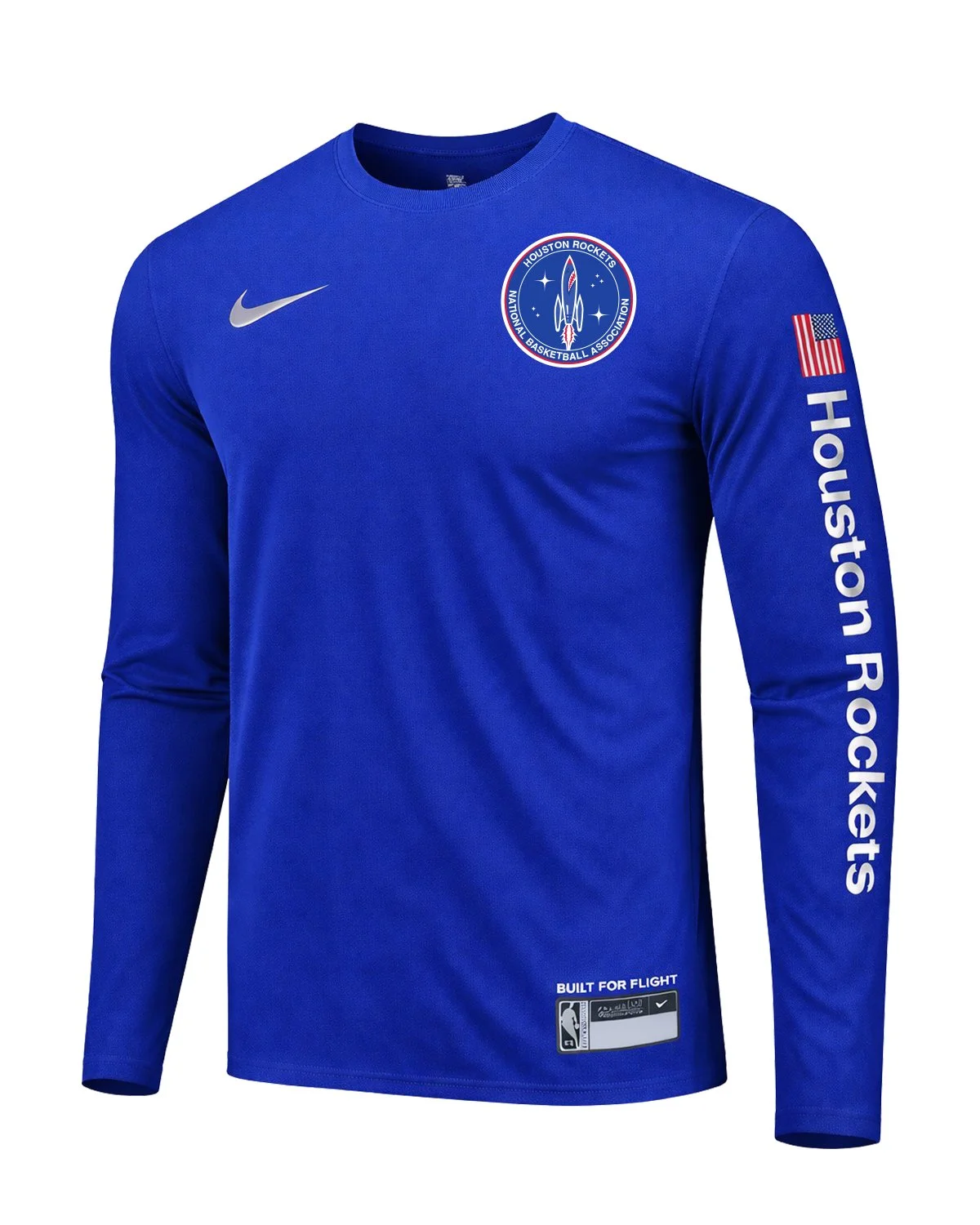 White long-sleeve shooting shirt with the mission-patch crest, a flag patch and “Houston Rockets” running down the sleeve in blue.