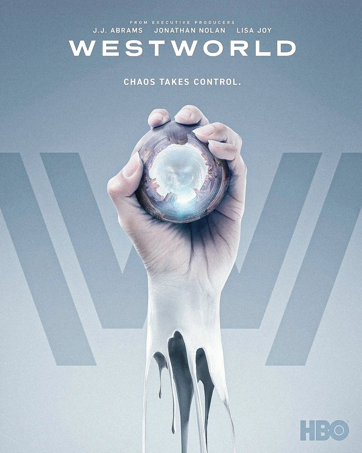 Westworld season 2 key art: a pale robotic hand holding a landscape inside a glass sphere, with “Chaos takes control” under the title.