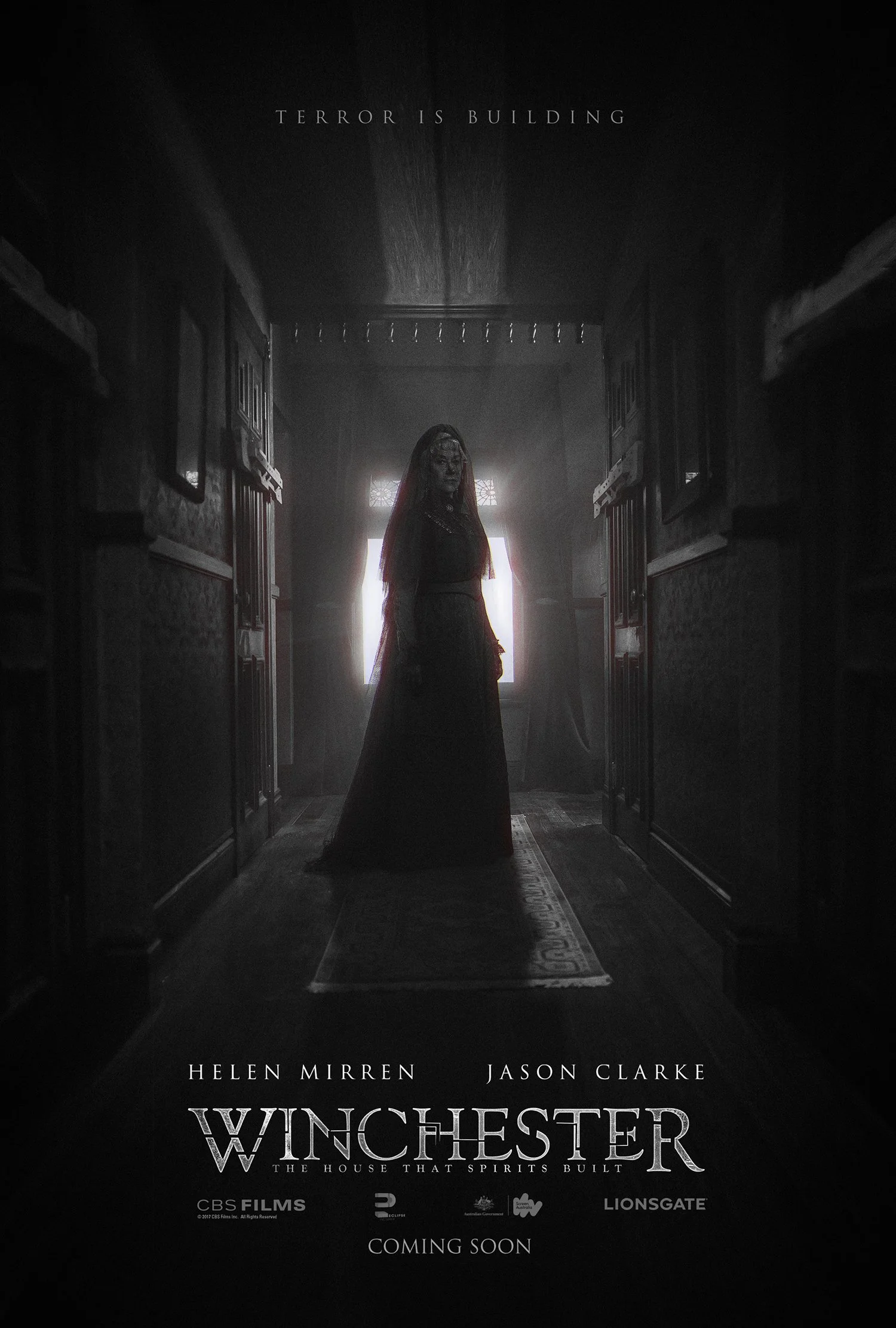 Winchester one-sheet: a woman in a black veil at the end of a long, dark hallway in the Winchester house.