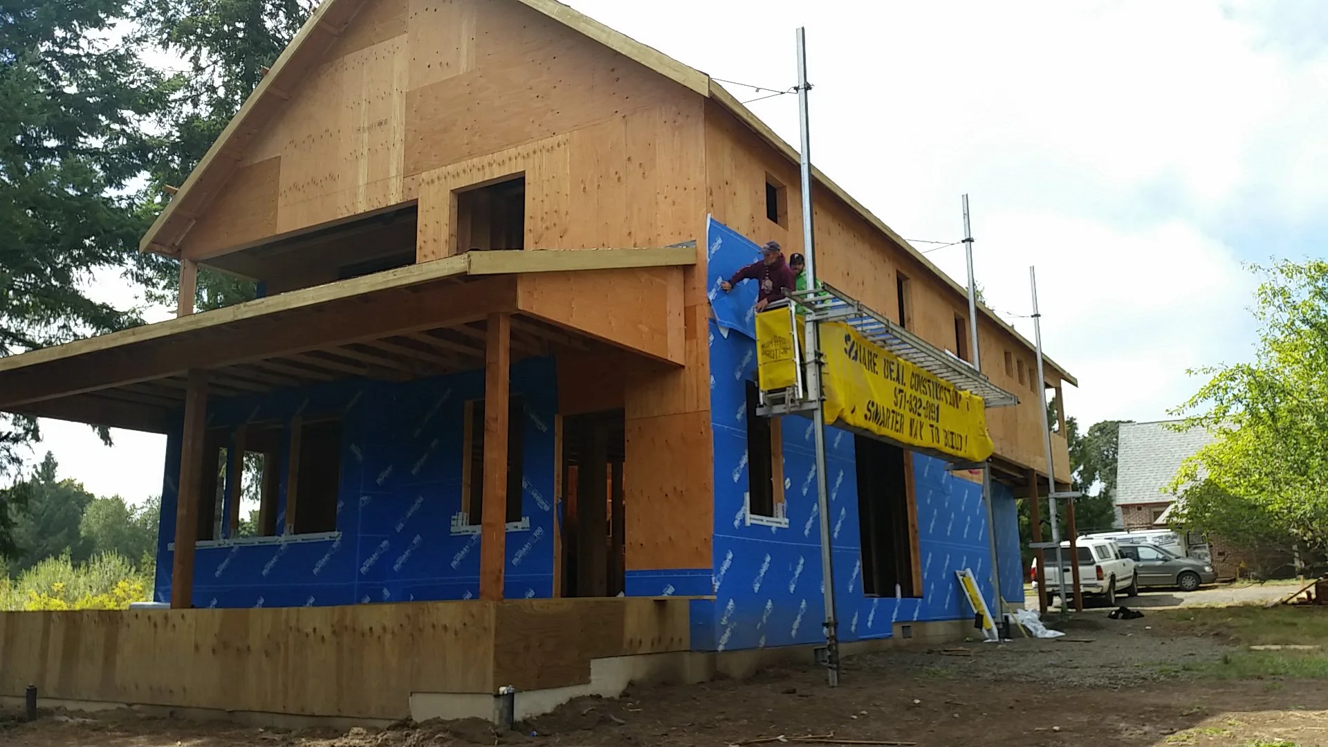 We are finally onto the housewrap phase. (And just in time for the rainy season!)