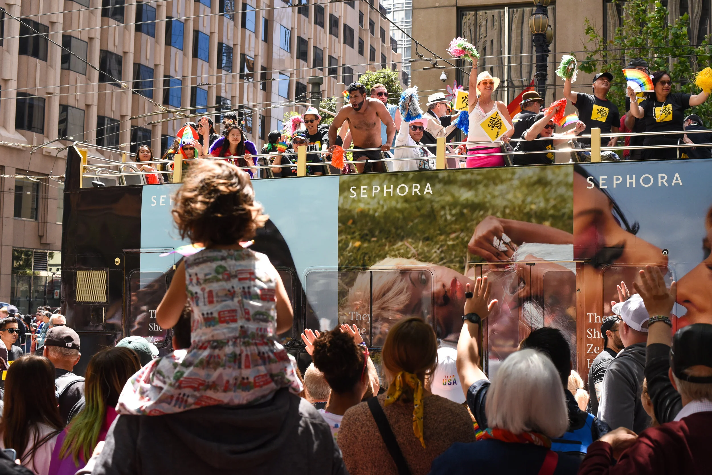 San Francisco AIDS Foundation bus in the Pride Parade on Market Street, 2019. It is one of the oldest and largest LGBTQ parades in the world.