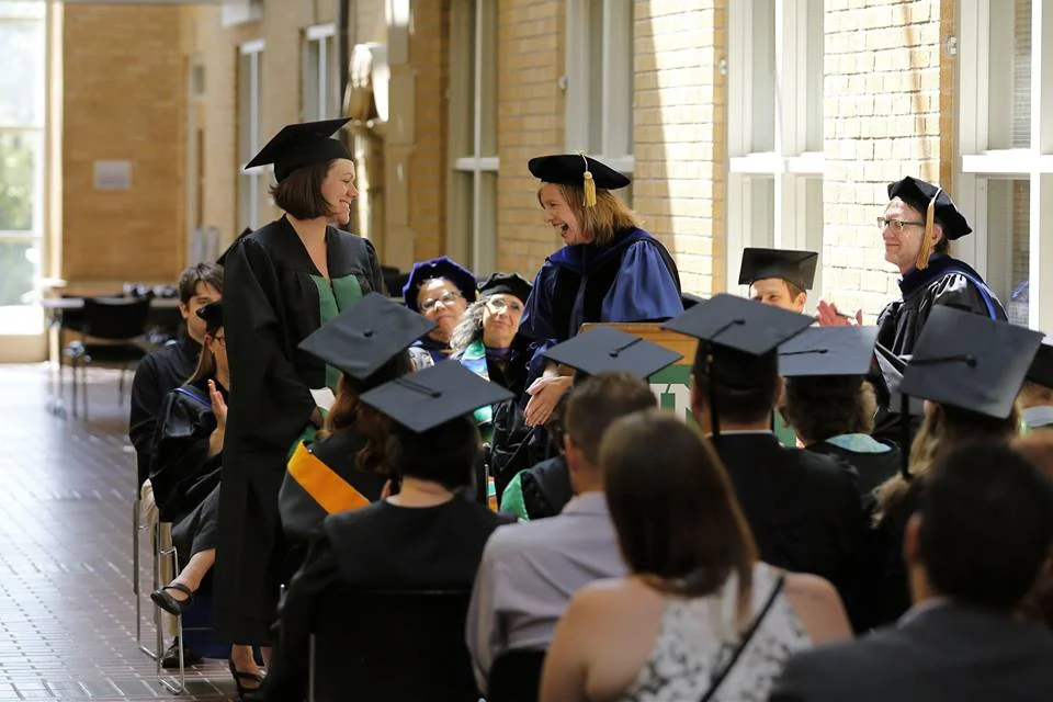 Christina about to hood Ashley.jpg