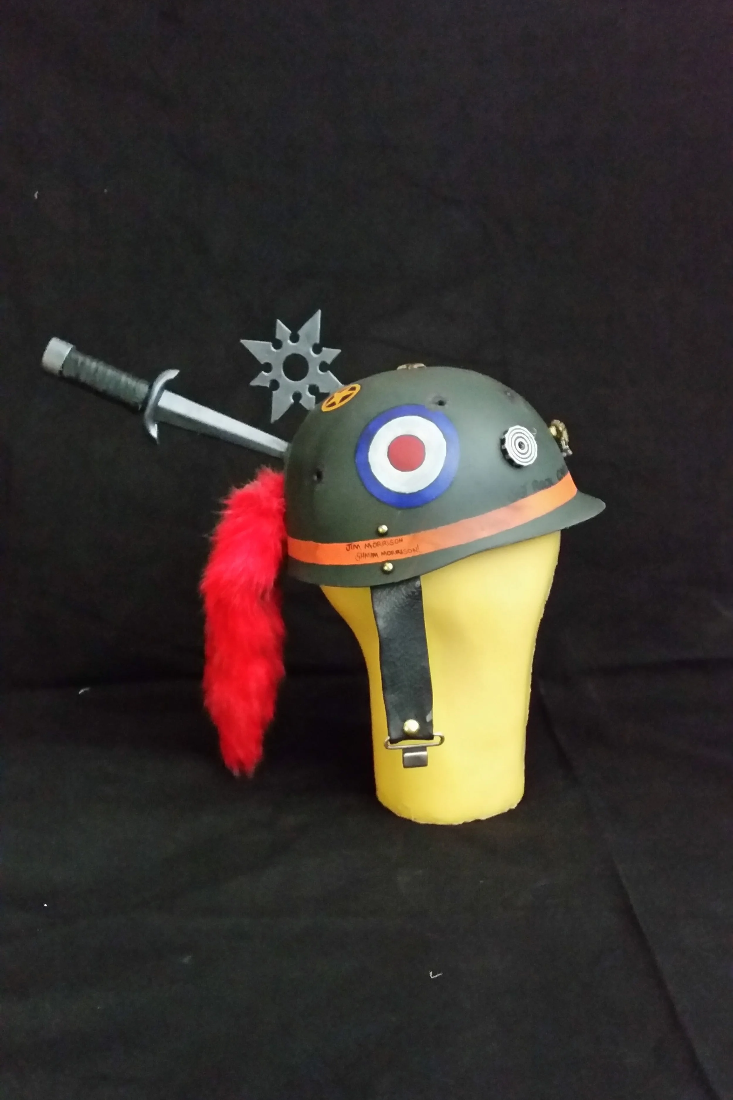 Tank Girl Cosplay, 2016 Personal Project for SDCC Helmet made from plastic toy helmet, toy weapons, faux tail key chain, leather straps, and acrylic paint