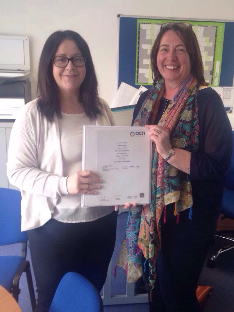 Joanne Coyle receives a certificate of completion for ‘Tenant Participation and Community Development OCN Level 2.’