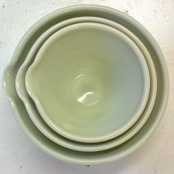 Thrown on the wheel and carefully measured with calipers, they come in three sizes that store well as a nest. Great for salads, sauces or for whisking up an omelette. #porcelain #tableware. #pottery  #celadon