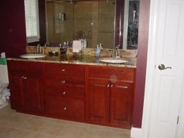Aristokraft - Saybrook door style - Birch wood - Rouge stain - Rainforest Green granite vanity top