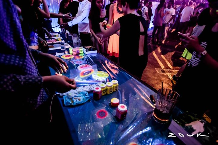 A UV paint tattoo booth was set up and the same custom-made designs were used as UV decorations that lined the interior of the club for the event. 