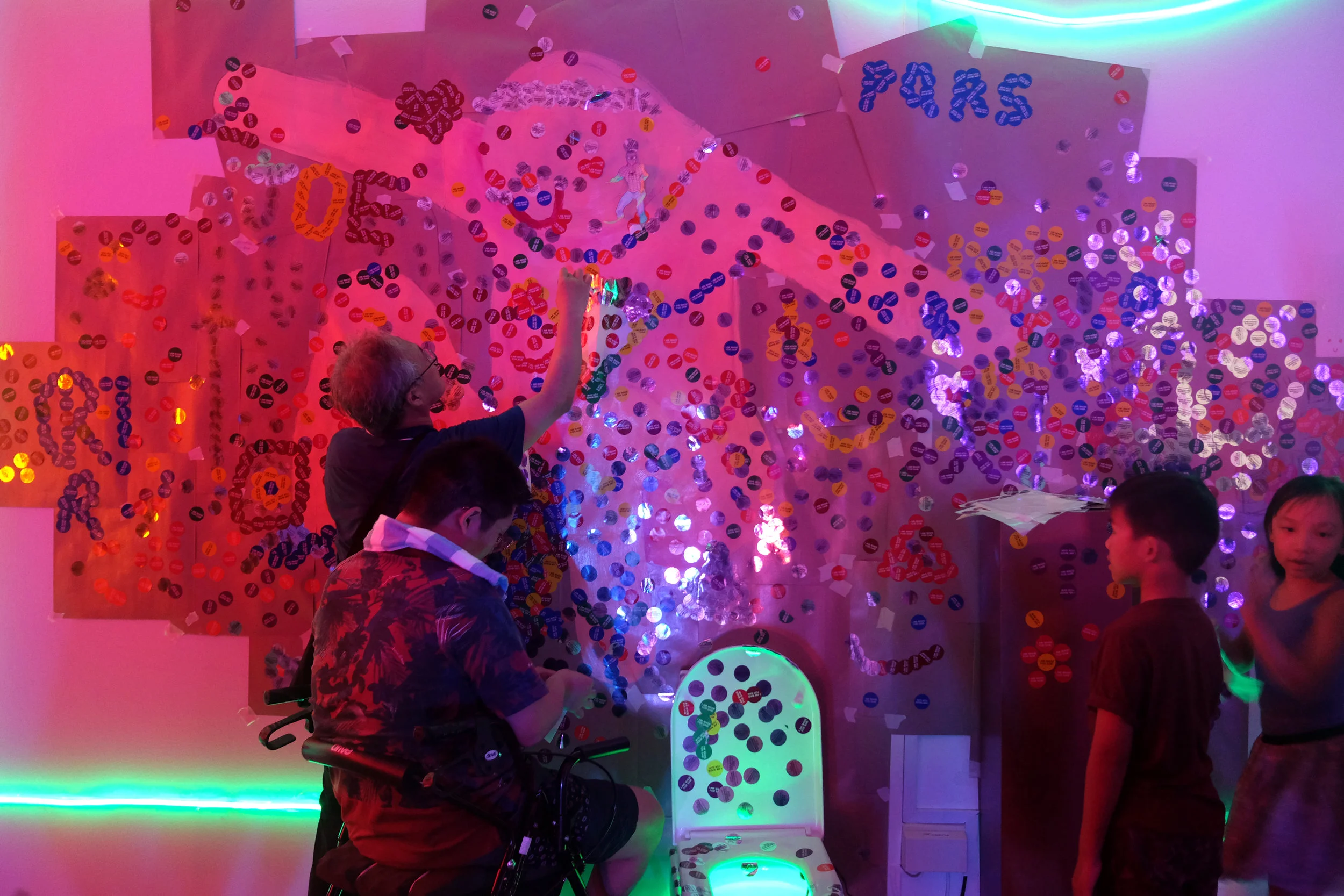 Visitors interacting with part of an installation in JOE.’s ‘ I’m just an average Joe, babe’.