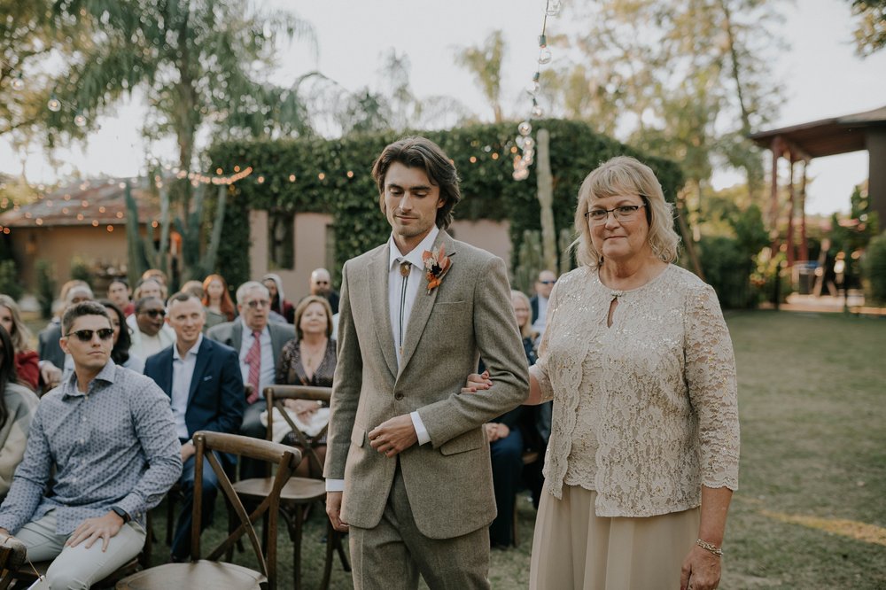  Beautifully captured moment at Robin and Billy's wedding at The Acre, Orlando, showcasing the venue's unique charm and the couple's travel-themed, bohemian style, by professional wedding photographer, Sufia Huq Portraits. 