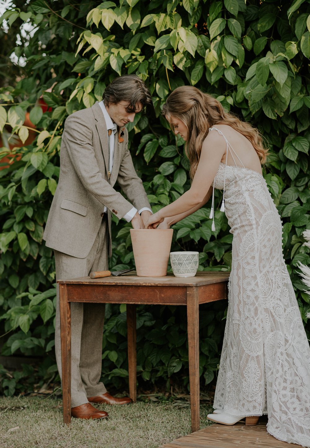  Beautifully captured moment at Robin and Billy's wedding at The Acre, Orlando, showcasing the venue's unique charm and the couple's travel-themed, bohemian style, by professional wedding photographer, Sufia Huq Portraits. 