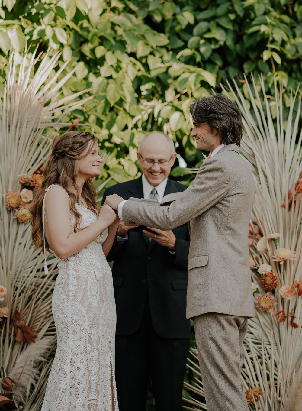  Beautifully captured moment at Robin and Billy's wedding at The Acre, Orlando, showcasing the venue's unique charm and the couple's travel-themed, bohemian style, by professional wedding photographer, Sufia Huq Portraits. 