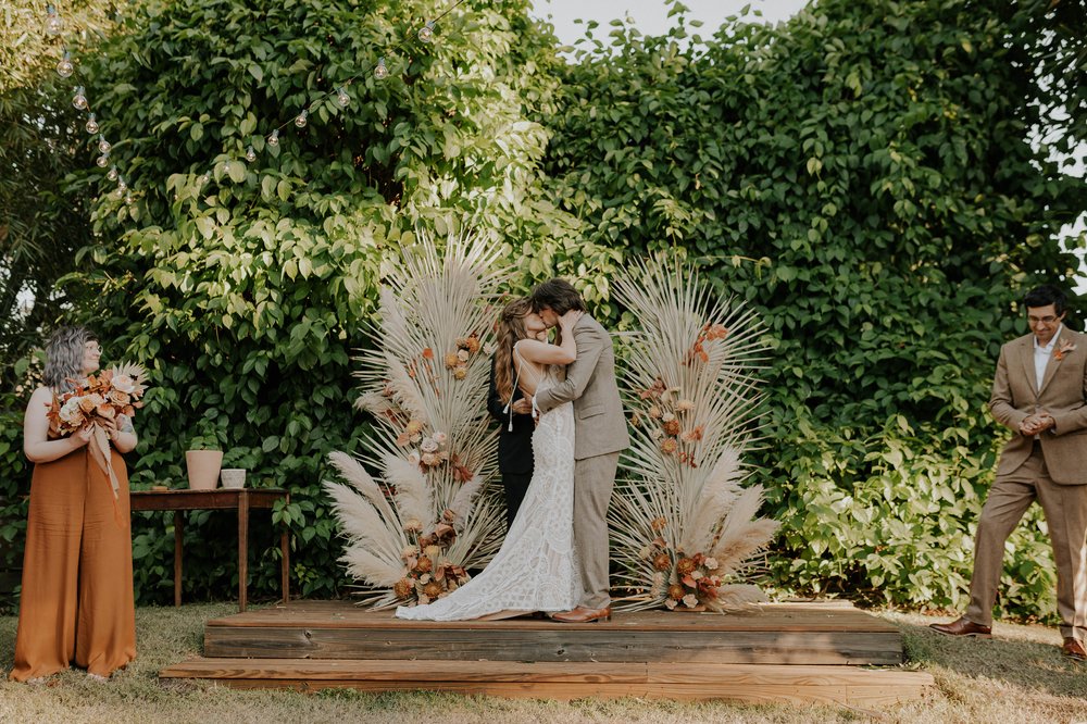  Beautifully captured moment at Robin and Billy's wedding at The Acre, Orlando, showcasing the venue's unique charm and the couple's travel-themed, bohemian style, by professional wedding photographer, Sufia Huq Portraits. 