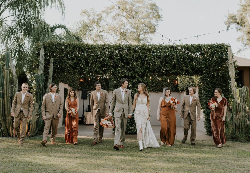  Beautifully captured moment at Robin and Billy's wedding at The Acre, Orlando, showcasing the venue's unique charm and the couple's travel-themed, bohemian style, by professional wedding photographer, Sufia Huq Portraits. 