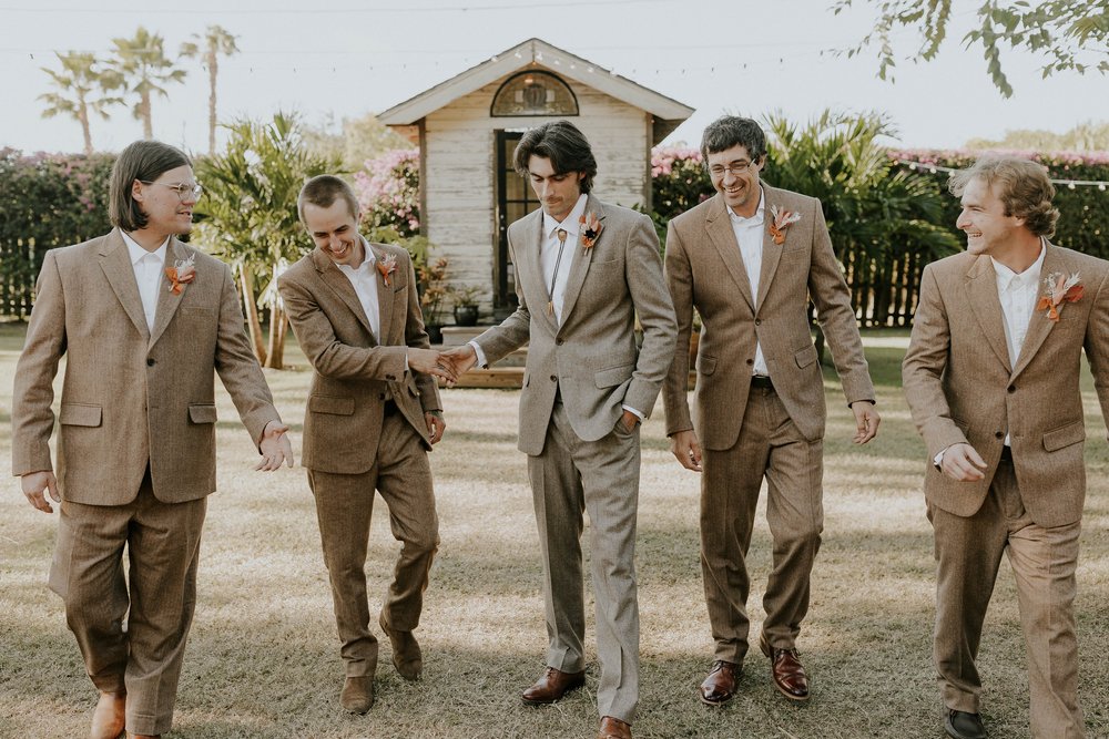  Beautifully captured moment at Robin and Billy's wedding at The Acre, Orlando, showcasing the venue's unique charm and the couple's travel-themed, bohemian style, by professional wedding photographer, Sufia Huq Portraits. 