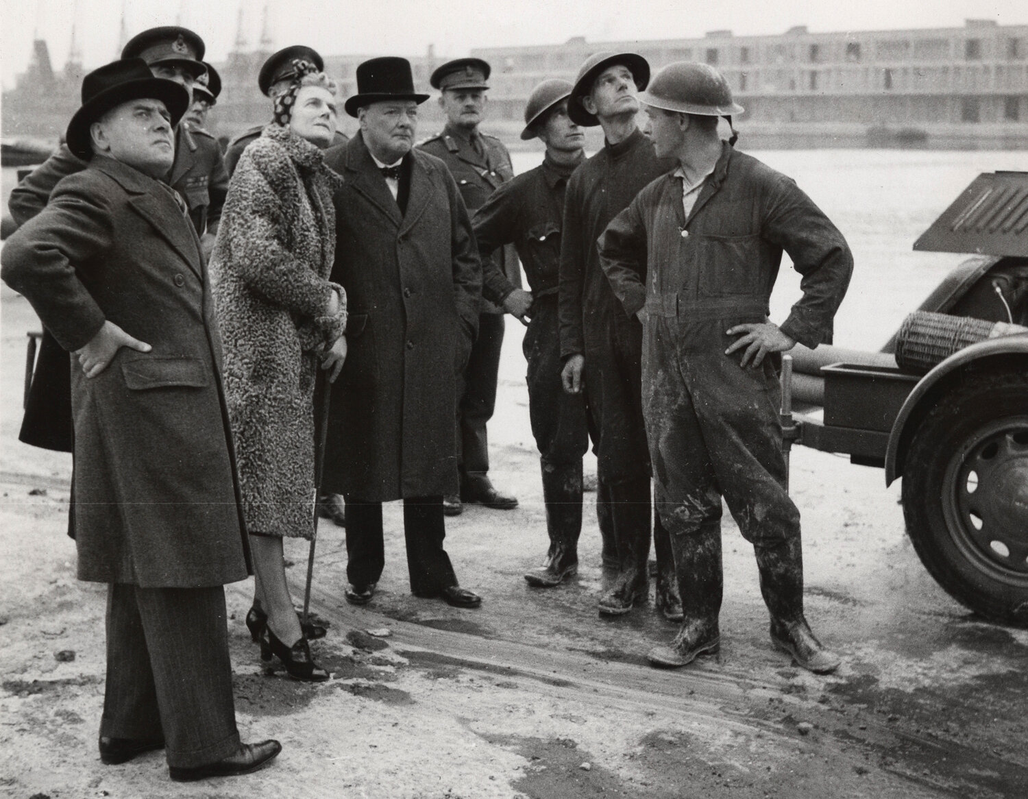 The Prime Minister and Mrs Churchill with a group of auxiliary firemen, touring London's dock in September 1940