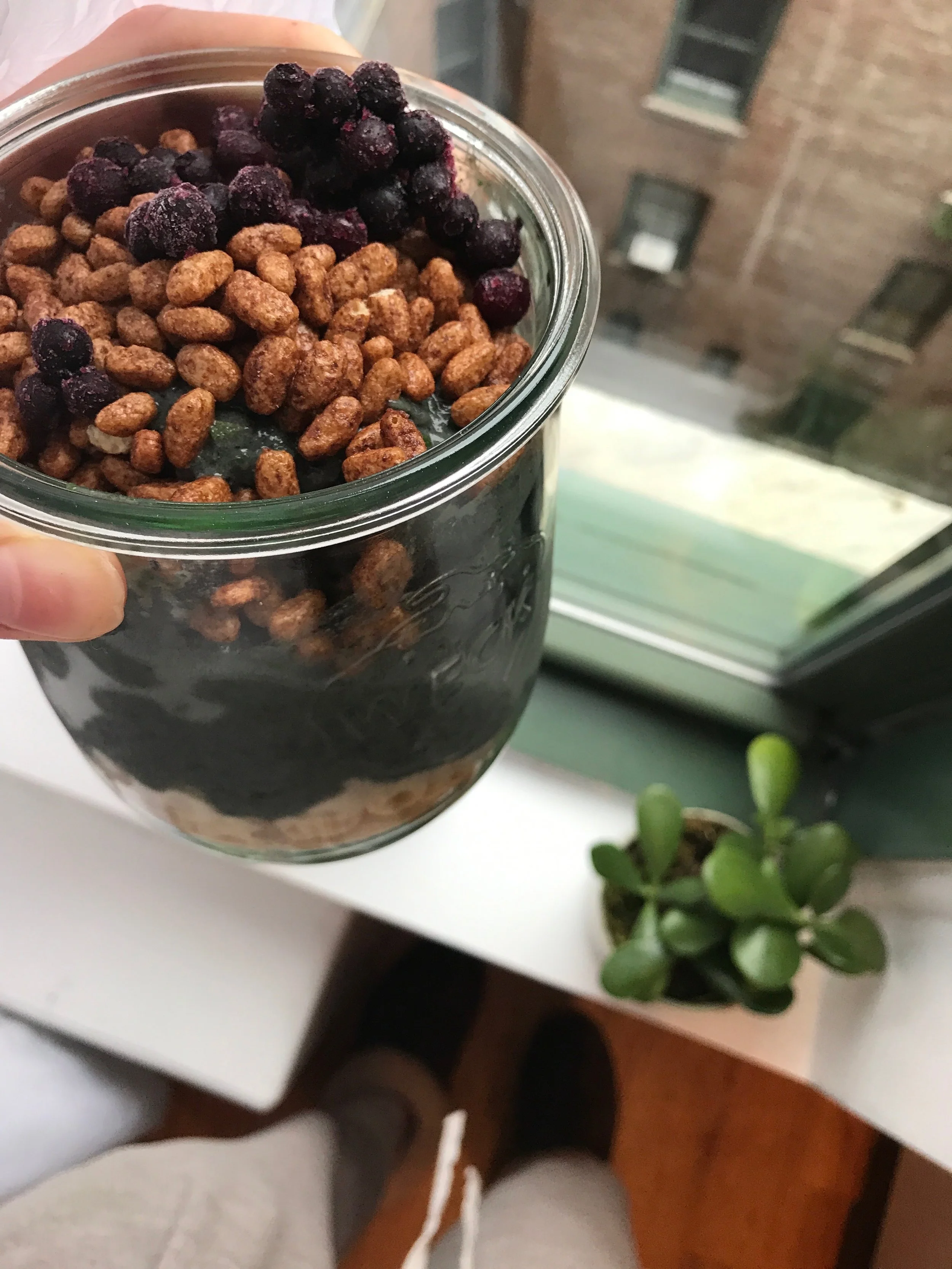 Mostly greens with pineapple + mango topped with GF cereal + blueberries. 