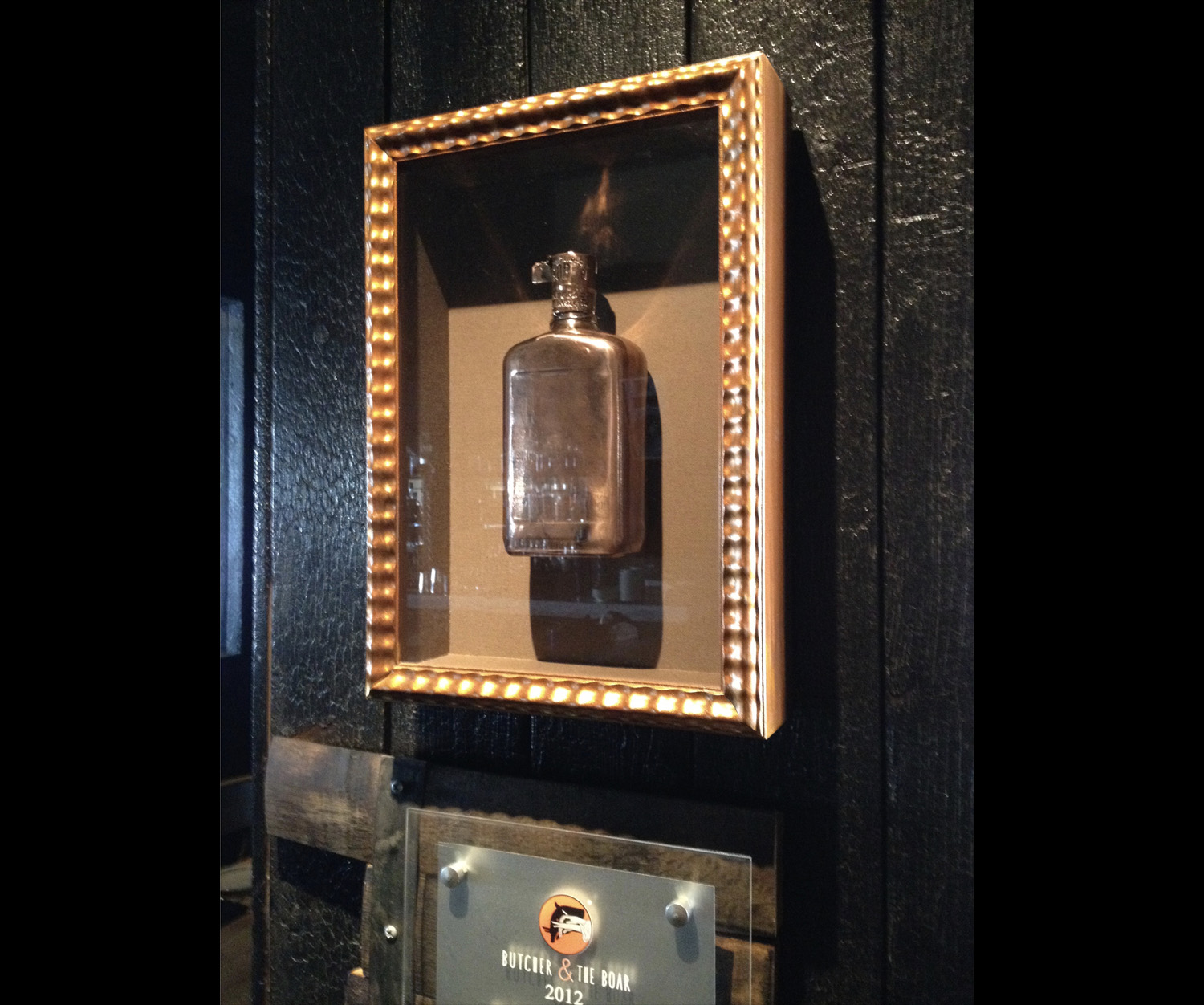  One of many whiskey bottles that we have framed for The Butcher and the Boar. 