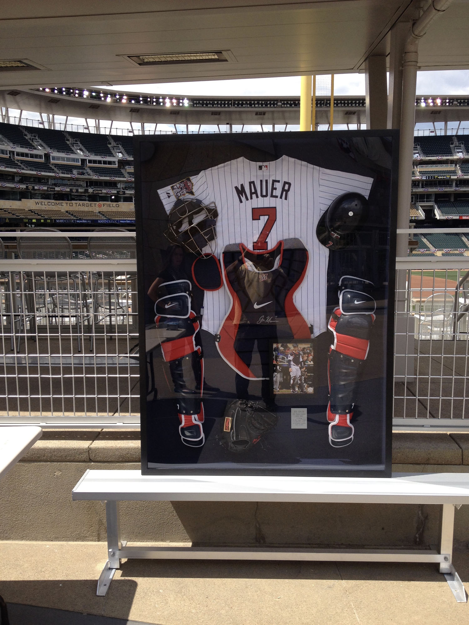 A shadowbox that we created to fit Joe Mauer's catcher uniform. We had to custom mill a frame to fit the depth of all the equipment. The shadowbox was auctioned off at the All Star Game at Target Field.