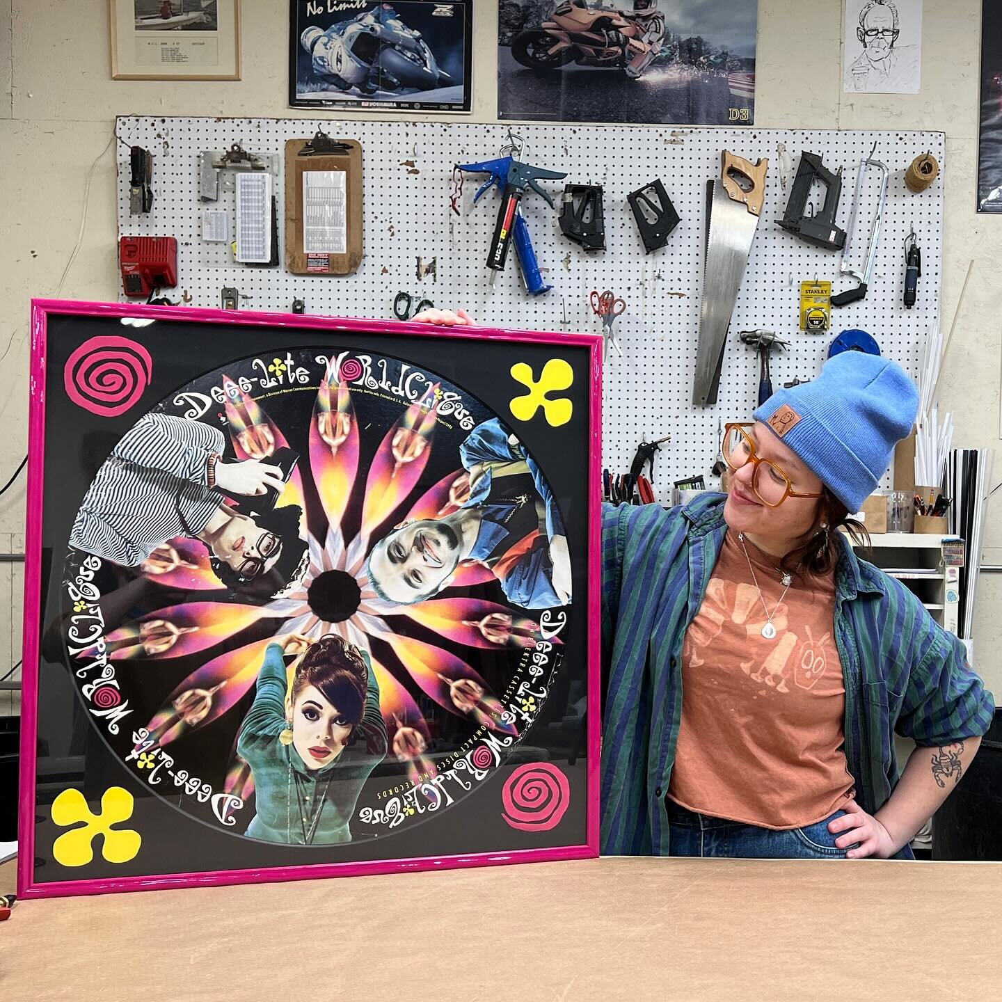 The real beauty of custom framing lies in just how custom the process can actually get..This morning Maddie finished hand-painting these corner decals on the matboard for this awesome Deee-Lite poster that was brought into the shop a few weeks back. 