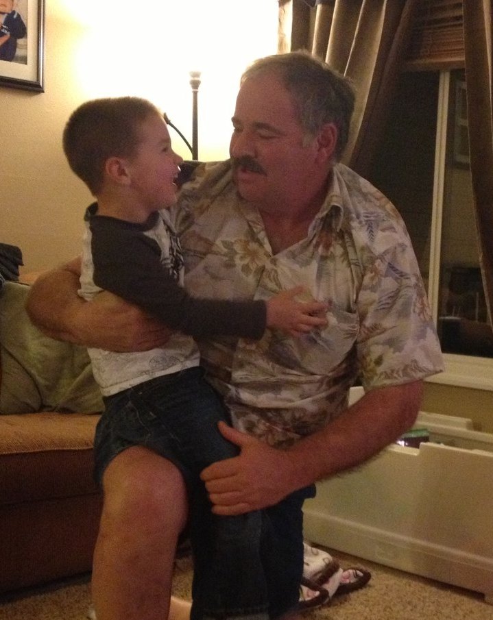 aiden on gramps knee.jpg