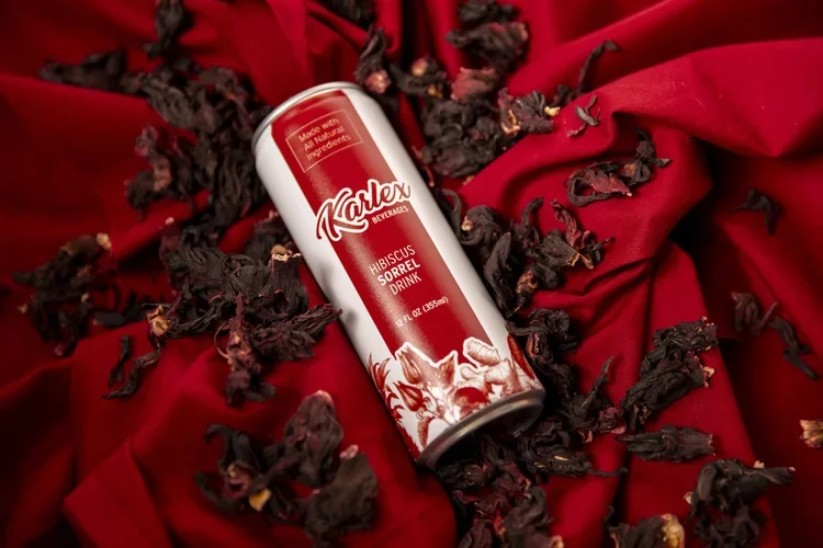 karlex-beverages-hibiscus-sorrel-pensacola-florida-fruit-pineapple-orange-ginger-can-red-curtain.webp