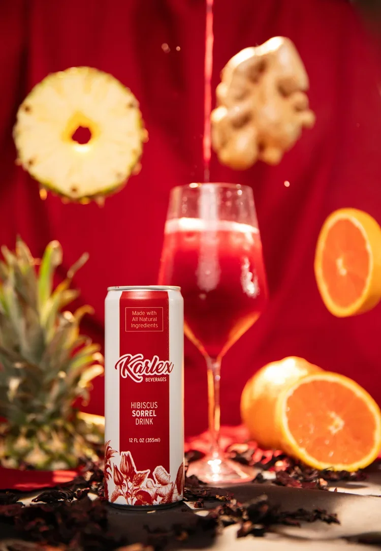 karlex-beverages-hibiscus-sorrel-pensacola-florida-fruit-pineapple-orange-ginger-drink-pour.webp