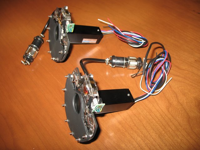 Reid, Wilson, Engert Labs: GaAs detectors used in 2 photon microscopy are very sensitive and easily damaged by excess light. These custom shutters are part of a protection system. They are designed to be very thin so as not to reduce the amount of light arriving at the detector. The central aperture is 1” in diameter.