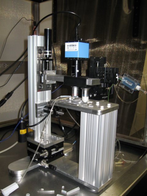  Landisman Lab: A slice patch clamp rig with integrated microscope. This microscope was designed to deliver D.I.C.-like image quality for visually guided patch recording. It provides a very stable and open platform and cost one-sixth the price of a t