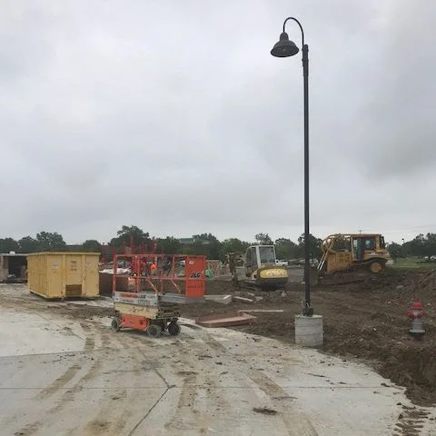 The concrete for all the light pole has been poured and the electrical strung. The first light pole is up with the others coming soon!
