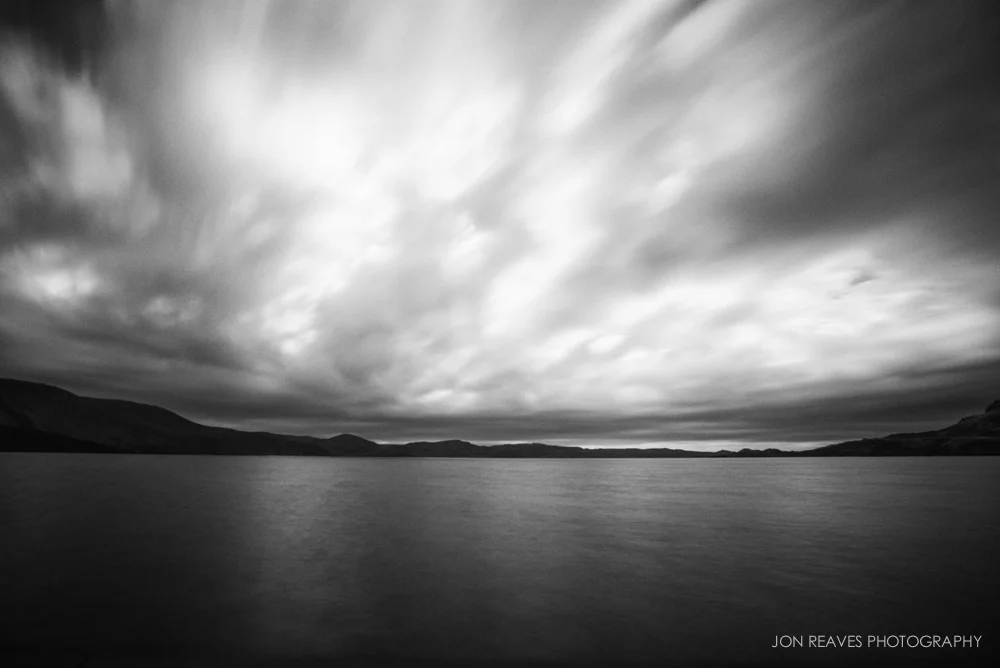 It was too cloudy for northern lights to be seen, so I made this long exposure at a lake at midnight.