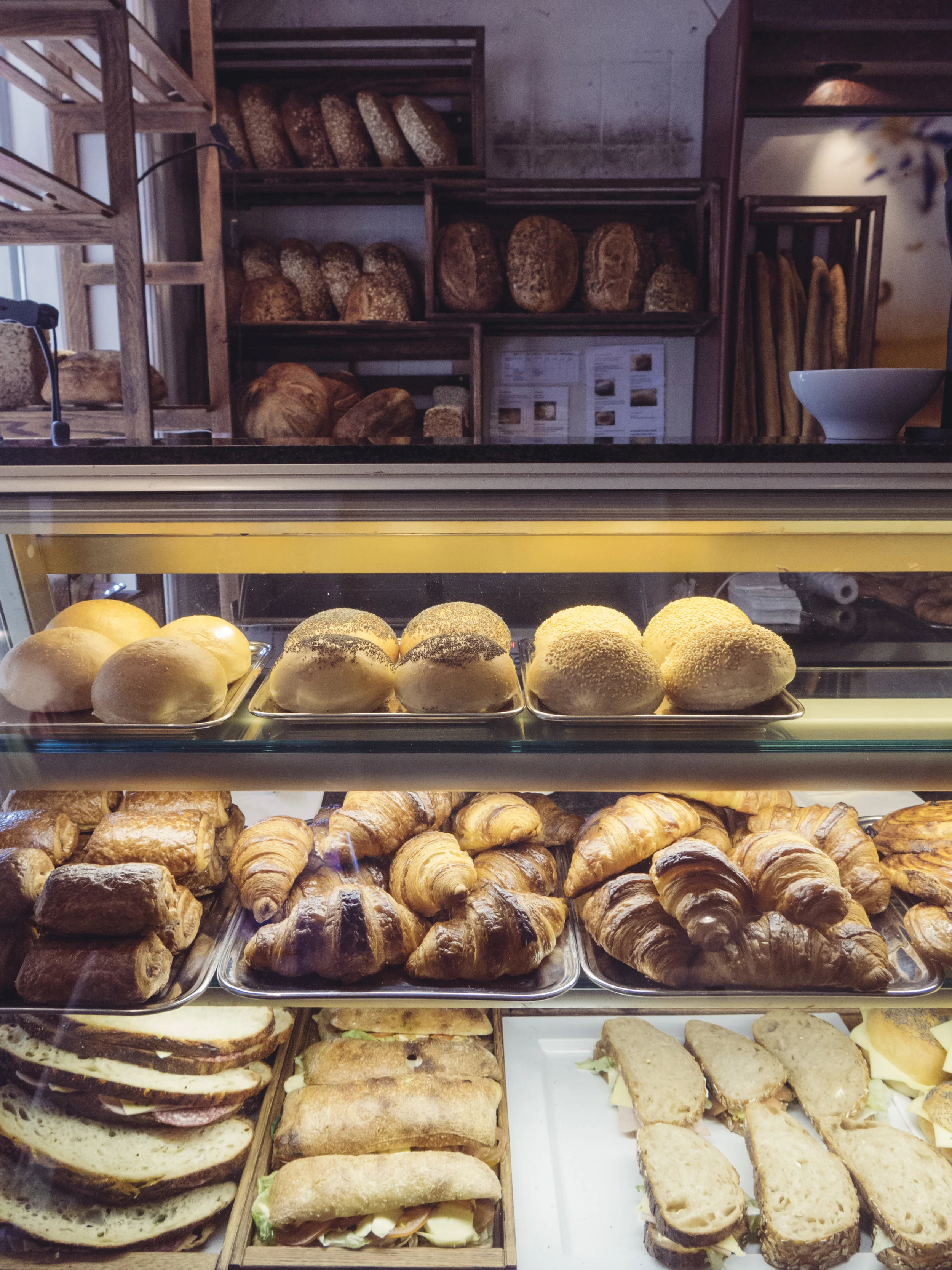 Freshly-made breads and sandwiches at Sandholt. Since I took this picture, Sandlot has renovated and installed a more modern display case and marble countertop. 