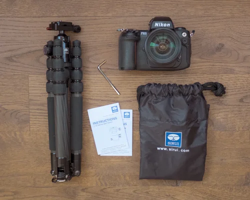 Sirui T-025x Carbon Fiber Tripod, C-10 Ball Head, Hex Key, Manuals, and Carrying Case (which doubles as a small backpack).