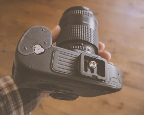 The small ball-head plate is attached to camera using a hex key (two included) or by using a coin.