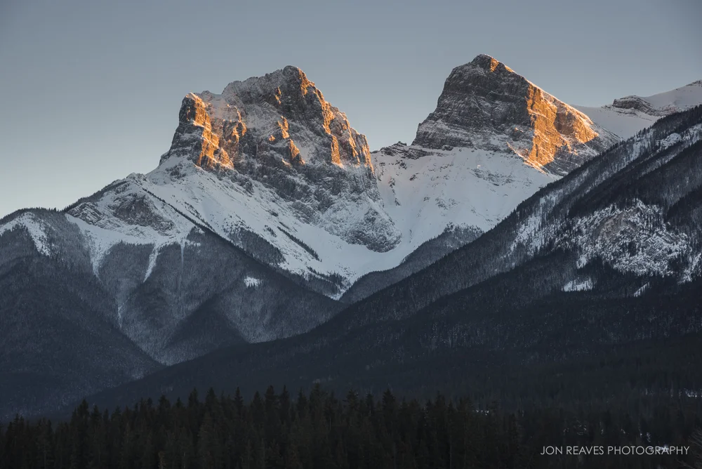 One of the few views of Three Sisters (two of the three) in Canmore free of power lines. Shot from a bridge in town centre.