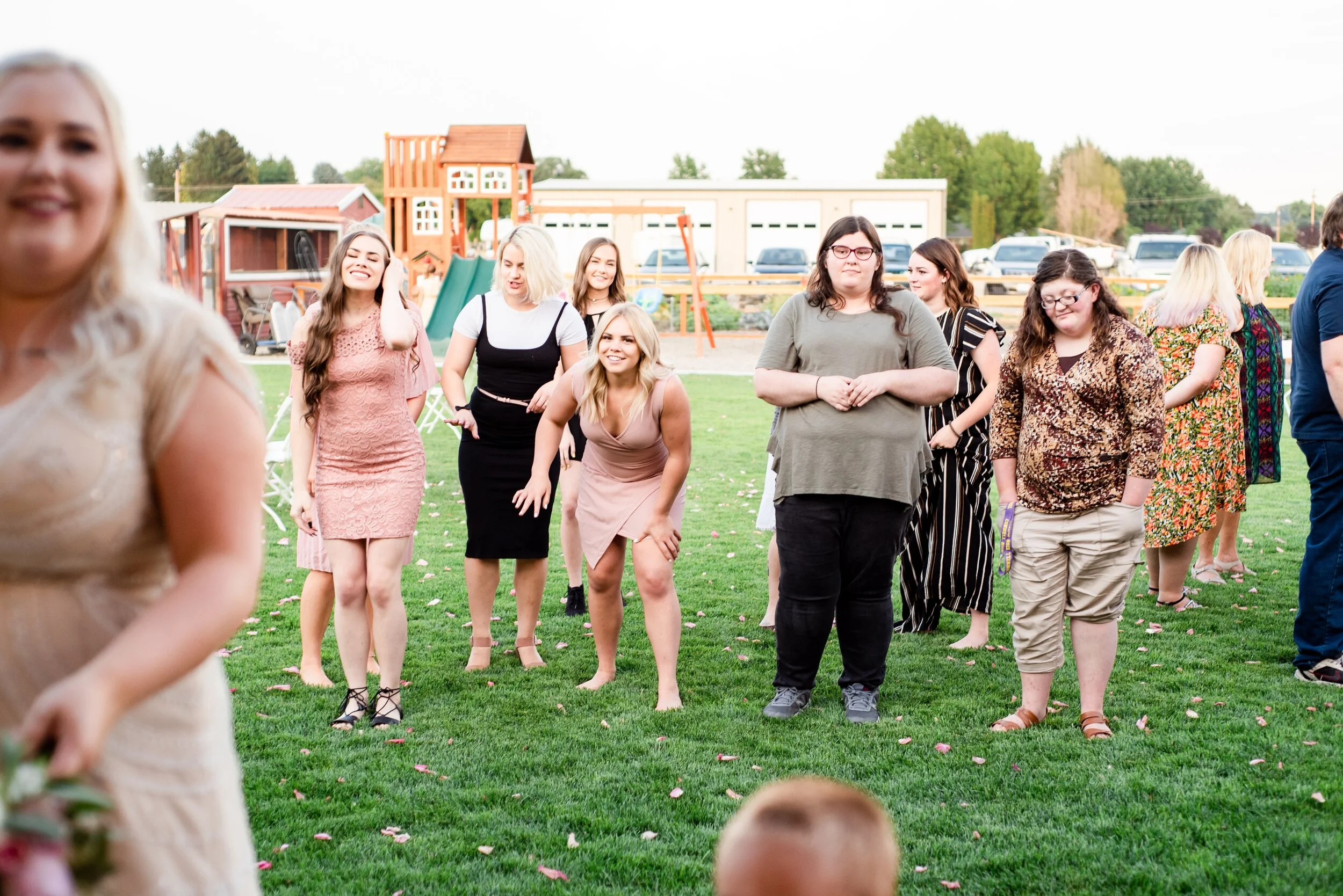 Bouquet Toss - Tri Cities Wedding Photographer - Morgan Tayler Photo & Design - Tri Cities Washington Backyard Wedding