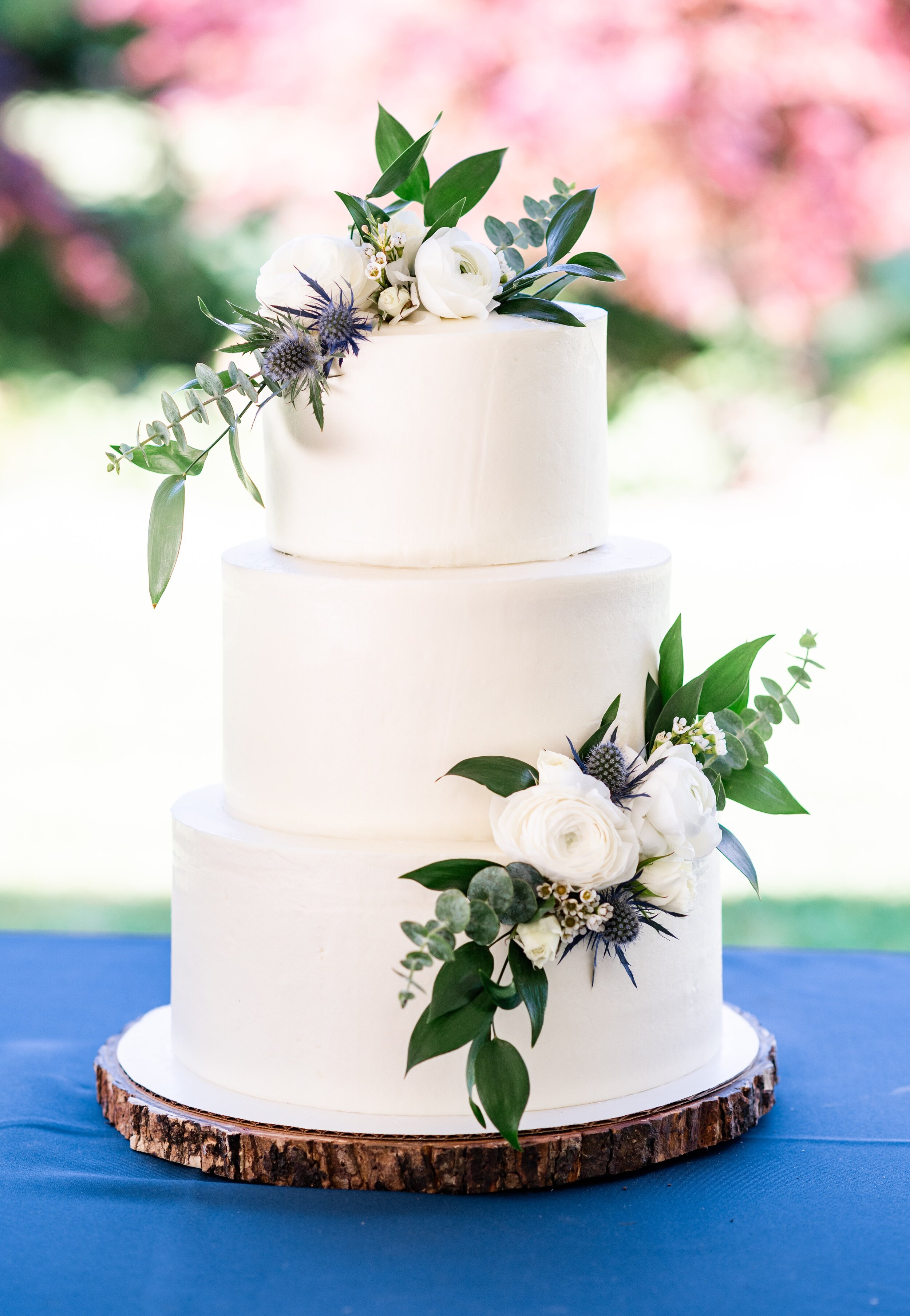 White Wedding Cake with Flowers and Gold Arbor - Harper Road Floral - Cake By Alicia - Promise Gardens Pasco Wedding Venue - Tri Cities Wedding Photographer - Morgan Tayler Photo &amp; Design