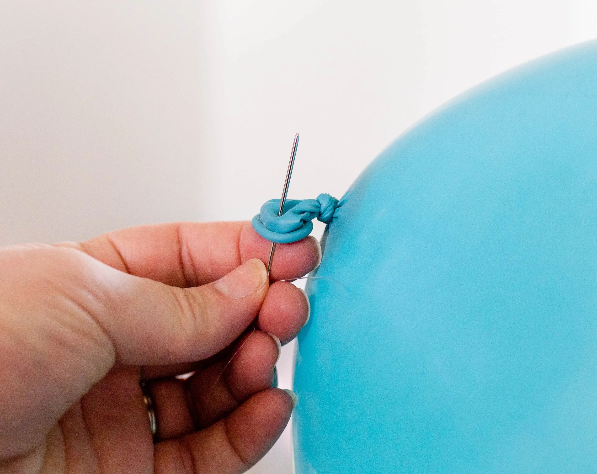 EVERYTHING You Need to Know About How to Make a Balloon Garland With Fishing  Line